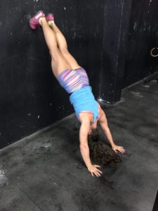 The Handstand Pushup! (And 5 Handstand Pushup Tips to Help Get You